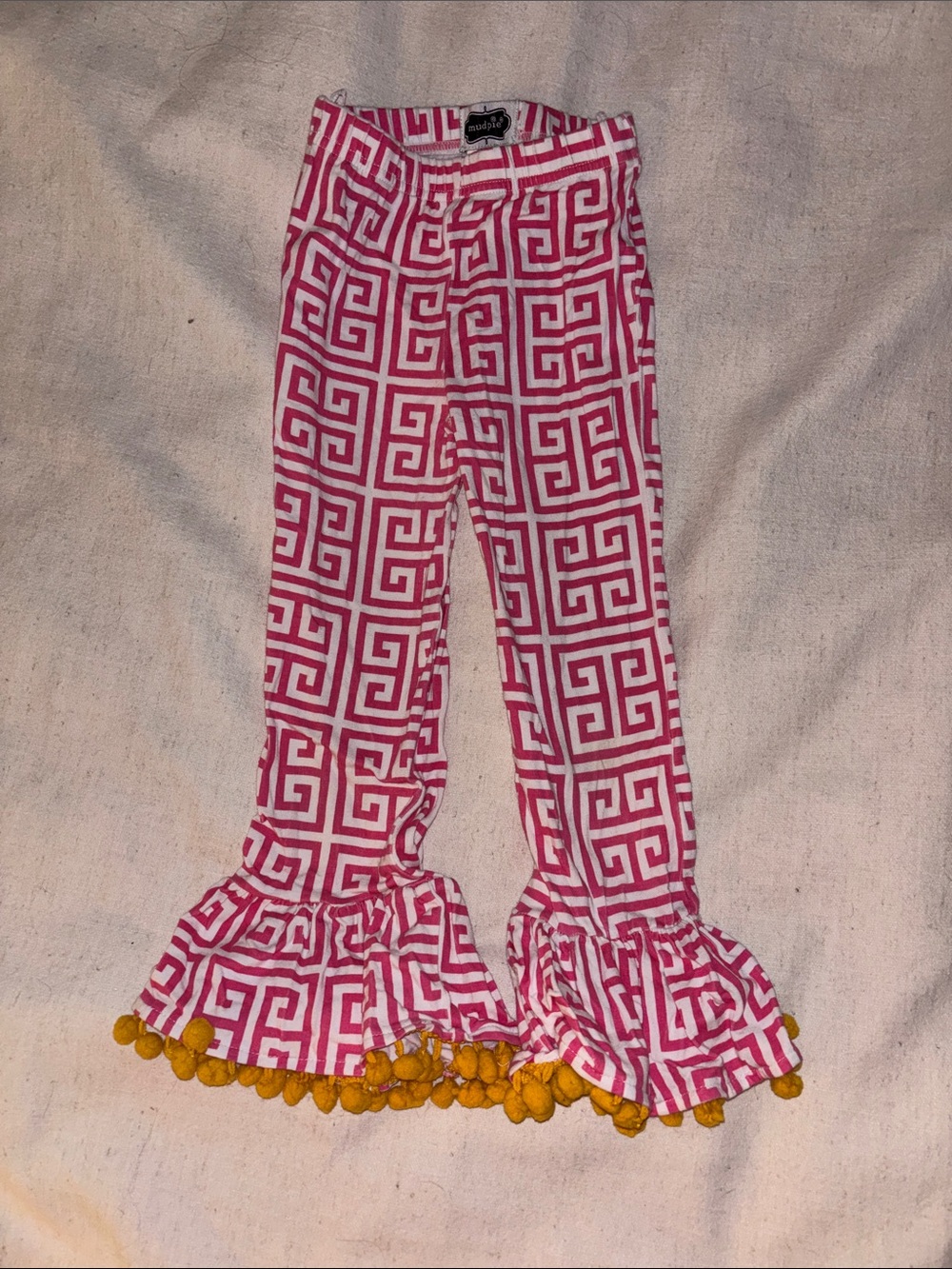 Girls Pink Key Ruffle Pants with Yellow Pom Trim